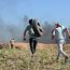 Gazan youths protest Israel's siege on Gaza on the border fence east of the Jabalia Refugee Camp | Photo by: Mohammed Zaanoun