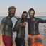 Some happy holiday tourists from England enjoy a 'spa experience' on the banks of the Dead Sea in Jericho, Palestine